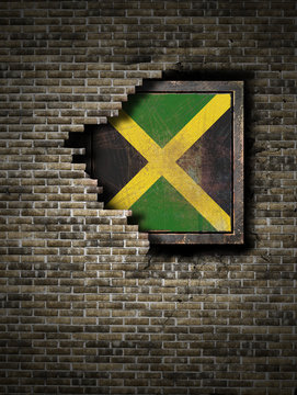 Old Jamaica flag in brick wall