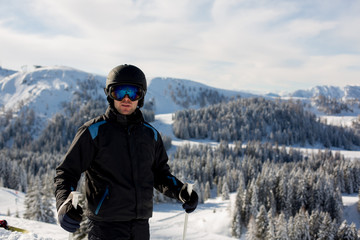 Fototapeta na wymiar Young man, skiing in Austrian Alps