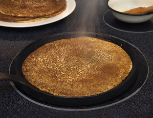 Making sourdough crepes.
