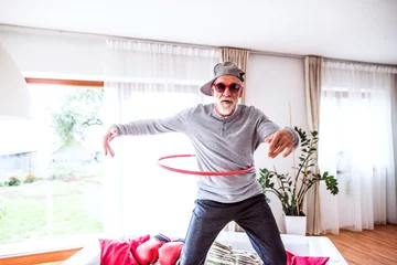 Foto op Plexiglas Senior man having fun at home. © Halfpoint