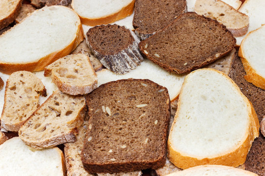 Many slices of bread as background. Top view