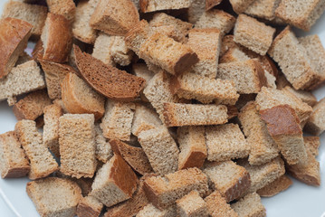 Close Up of Homemade Baked Fresh Crackers in White Plate on White Background. Healthy food. Top view. Isolated. Half of Plate.