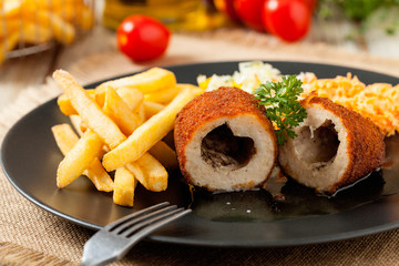 Chicken Kiev (de Volaille chop) with french fries and salads.