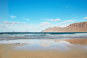 Landscape with volcanic hills and atlantic ocean in Lanzarote
