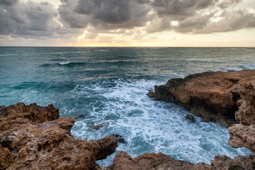 fantastic stunning colorful landscape, sunset on the shore of the blue sea, the coast of Cyprus, the neighborhood of Paphos