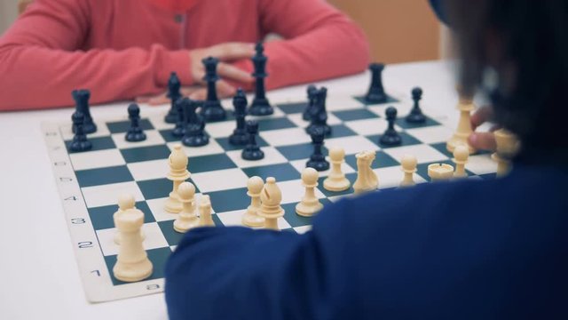 Chessboards close-up. Children playing chess.