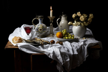 Classical Baroque Still-life in Dutch breakfast style on a black Background