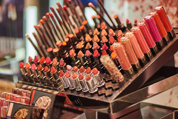 A lot of colorful makeup attributes in a store on the market