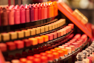 A lot of colorful makeup attributes in a store on the market