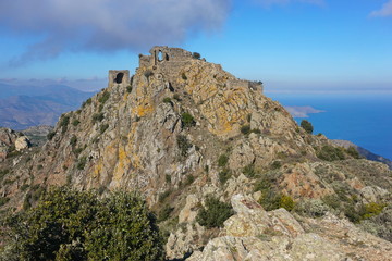 Fototapeta na wymiar Spain the ruins of the castle de Verdera located at the top of a steep rocky spur, Catalonia, Alt Emporda, Girona, Costa Brava
