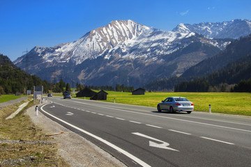 Fototapeta premium Austria. Alps, April. View of the highway in the Alps