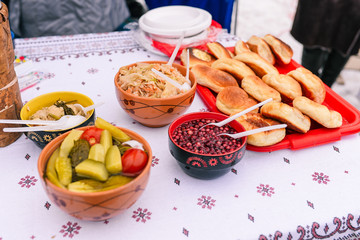 Covered table with cranberry pie pies