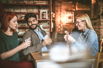 Tree young friends spending time together.