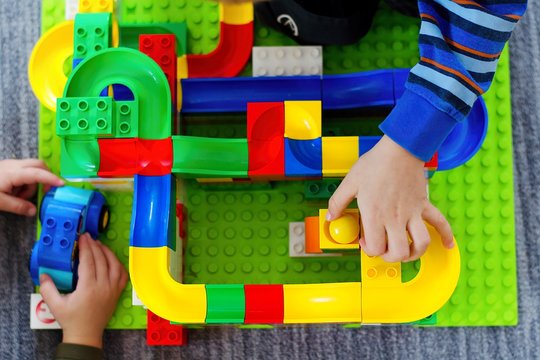 Child Playing With Marble Race Run Track