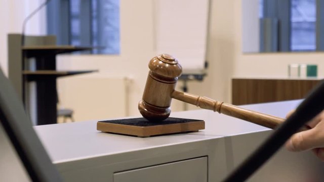 Gavel at a courtroom in slow motion