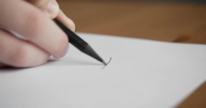Small hand drawing on blank paper with a pencil.