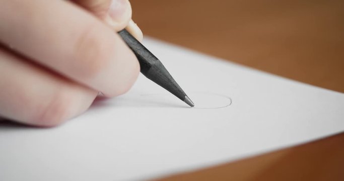 Small hand drawing on blank paper with a pencil.