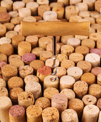 old corks on wooden table background