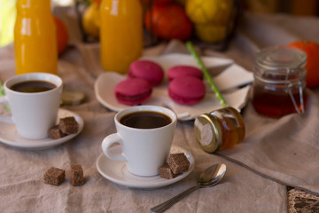 Obraz na płótnie Canvas Breakfast with coffee cups, orange juice, cake
