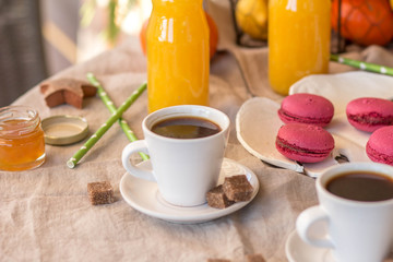 Fototapeta na wymiar Breakfast with coffee cups, orange juice, cake