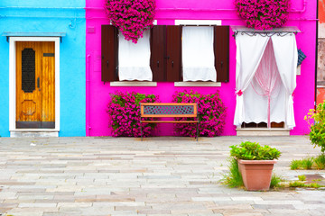 Fototapeta na wymiar Colourfully painted house facade on Burano island,Venice, Italy
