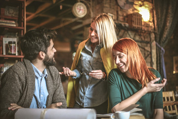 Coffee break is great for business discussion. Young business colleagues.