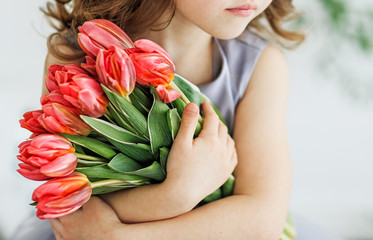 girl with a bouquet of tulips