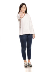 Angry woman showing stop hand on white background