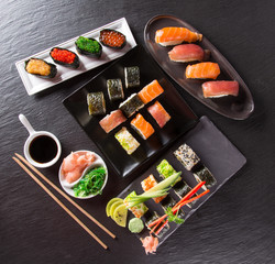 Japanese Sushi over black background.