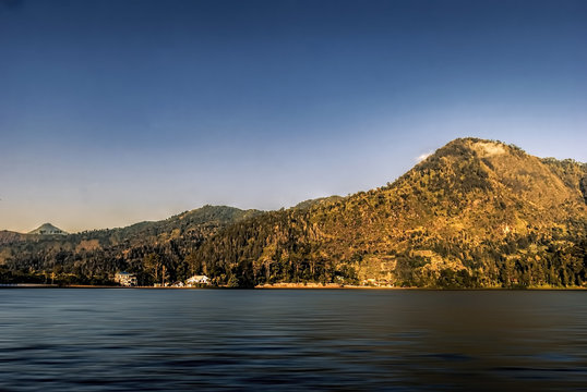 SARANGAN lake in Lawu highland, Central Java, Indonesia with clear blue sky.