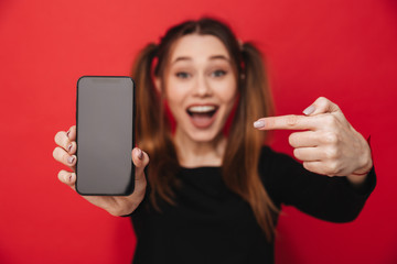 Young excited lady showing display of mobile phone