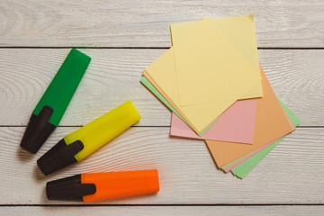 Stationary, Blank Stickers, Colorful Markers, Highlighters on White Wooden Background. Business Planning Concept.