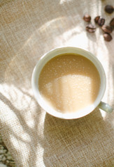 A cup of coffee in the morning sun.