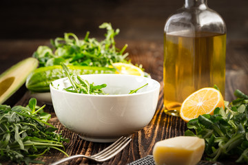 Lettuce and a bottle of olive oil