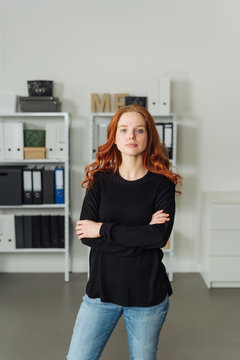 Serious confident young woman in an office