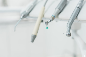 Close-up view of row of dentistry tools in modern clinic