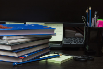 Computer in office with books