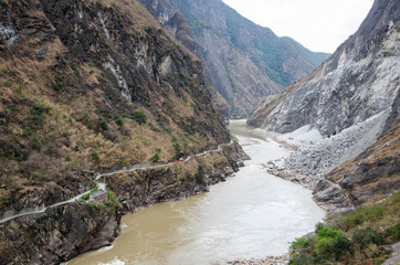 Fototapeta na wymiar The torrential flow through the hills in Tibet