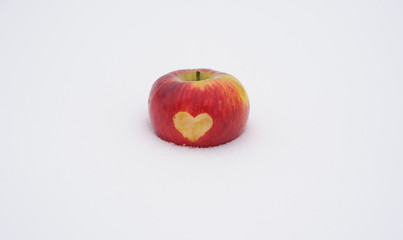 red apple on the snow