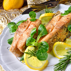 Fried carp fillet on wintry salad