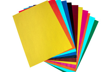 The different colored paper, cardboard on a white background. School accessories. Preparing a child for school.