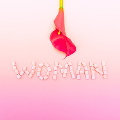 the inscription the Woman is lined with marshmallows and a Lily flower in the form of female body parts. creative metaphor. international women's day. gradient colors. symbolism