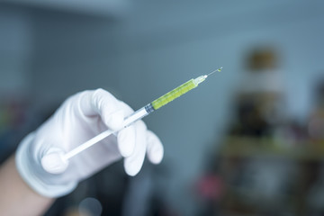 A Doctor prepared syringe of vaccine to injunction patient
