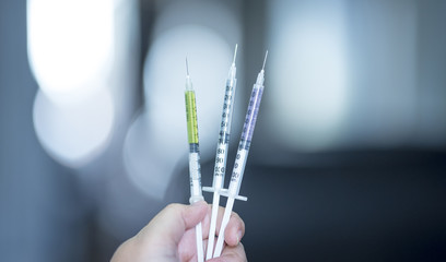 A Doctor prepared syringe of vaccine to injunction patient