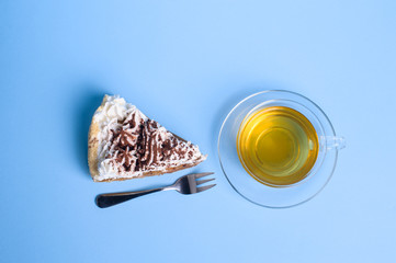 cake with tea on blue background