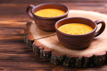 Indian turmeric milk with saffron, cardamom and turmeric. Copyspace