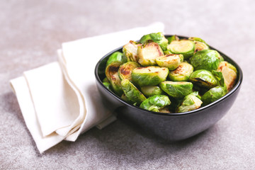 Vegetarian cuisine. Brussels Sprouts roasted with olive oil. Copyspace