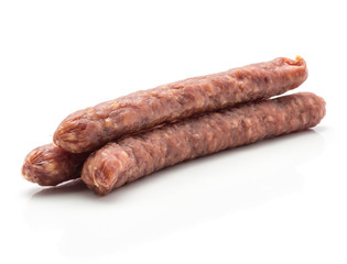 Three Hungarian dry sausages pepperoni isolated on white background smoked in natural casing mixed pork and beef.