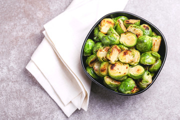 Vegetarian cuisine. Brussels Sprouts roasted with olive oil. Copyspace