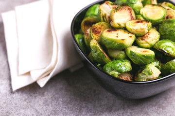 Vegetarian cuisine. Brussels Sprouts roasted with olive oil. Copyspace